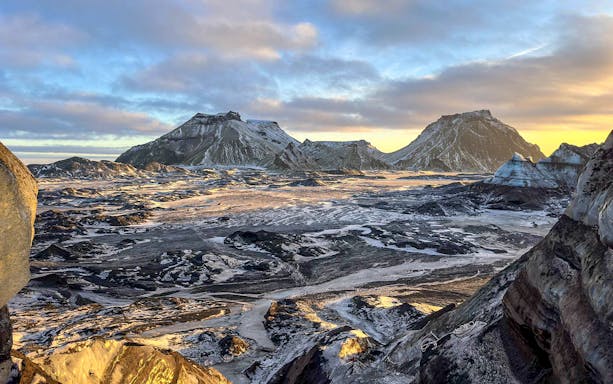 South Coast landscape with snow-covered mountains during Reykjavik tour.