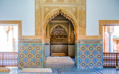 Decorative mosaic tiles and arches in the Saadian Tombs, Marrakech, Morocco.