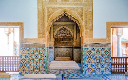 Decorative mosaic tiles and arches in the Saadian Tombs, Marrakech, Morocco.