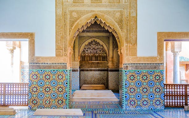 Decorative mosaic tiles and arches in the Saadian Tombs, Marrakech, Morocco.