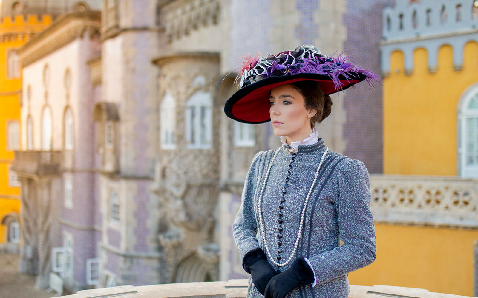 Woman in period costume at Palace of Pena, Sintra, Portugal, for theatrical tour.