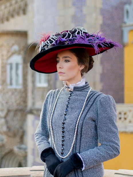 Woman in period costume at Palace of Pena, Sintra, Portugal, for theatrical tour.
