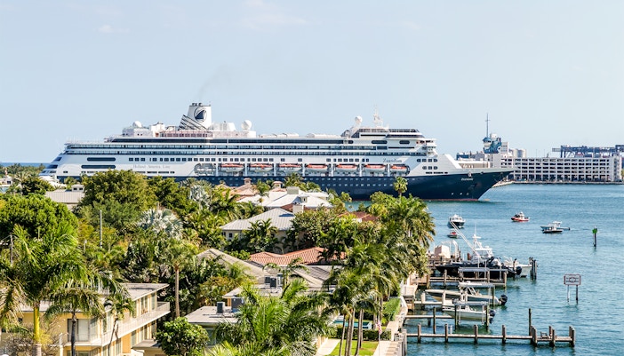 Cruise ship docked at Port Everglades, Fort Lauderdale, Miami FL, with passengers boarding for a Caribbean tour.