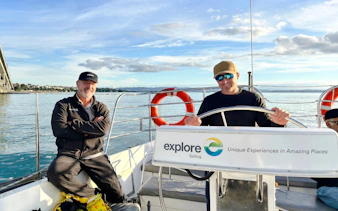 Sailors on a boat during Auckland Waitematā Harbour sailing cruise.