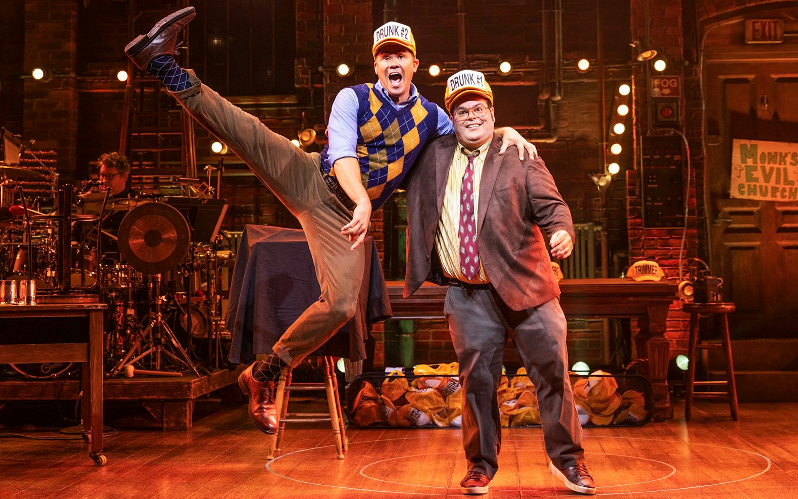 Performers on stage in "Gutenberg! The Musical!" with lively expressions and props.