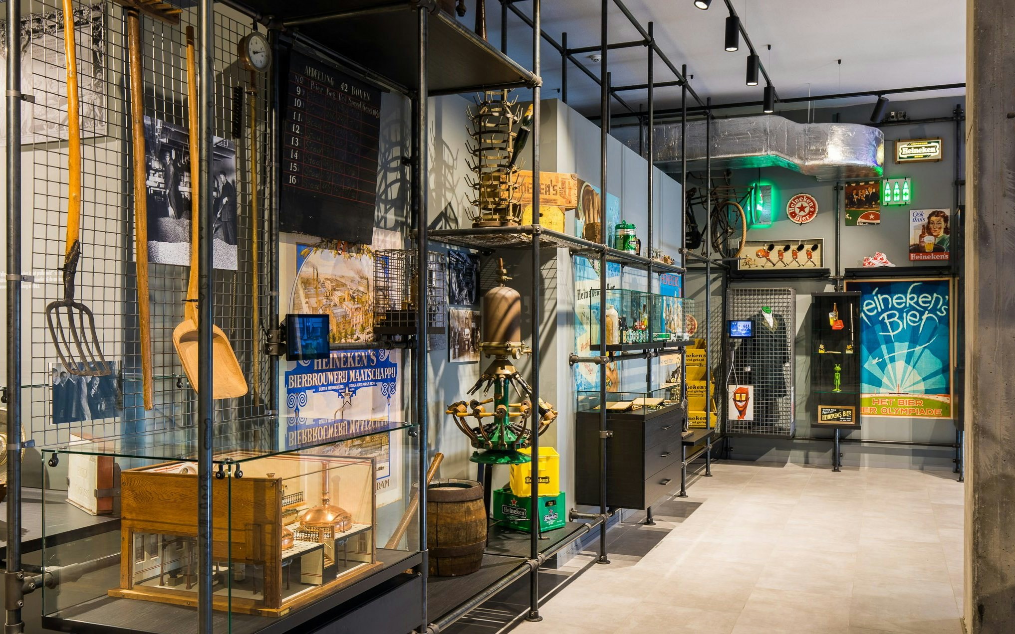 Heineken Experience museum exhibit showcasing brewing artifacts in Heritage Quarter, Amsterdam.