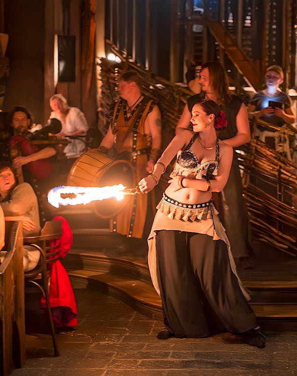 Fire performer entertaining guests at a themed event in Dubai.