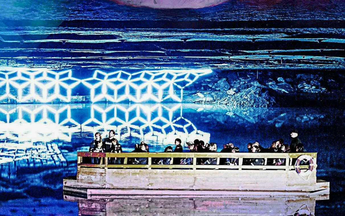 Guests on a boat tour of Mirror Lake inside Berchtesgaden Salt Mine.