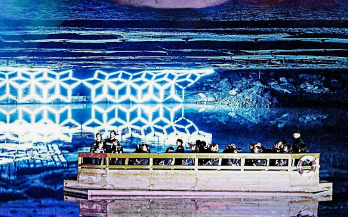 Guests on a boat tour of Mirror Lake inside Berchtesgaden Salt Mine.