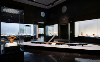 Artifacts displayed in Kyushu National Museum exhibit room.