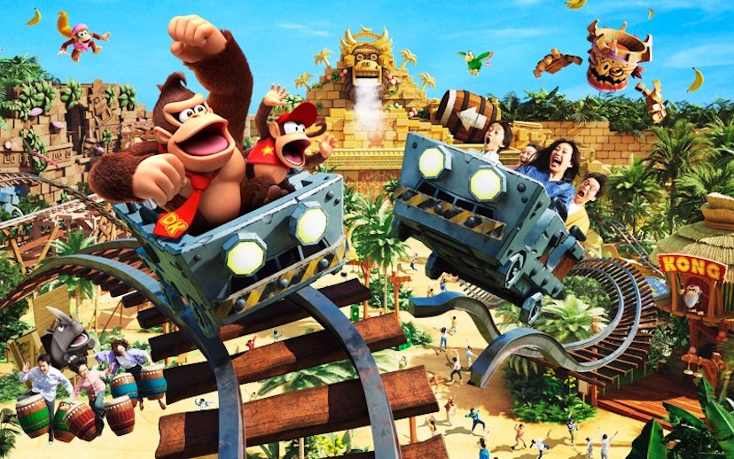 Roller coaster ride at Universal Studios Japan with jungle theme and animated characters.
