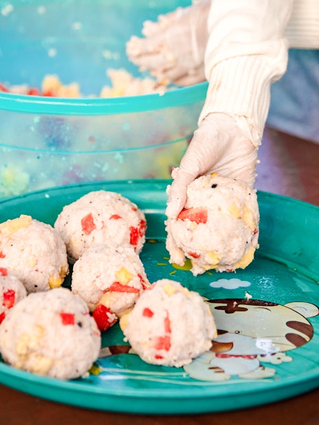 Preparing rice balls at Bukit Elephant Park.