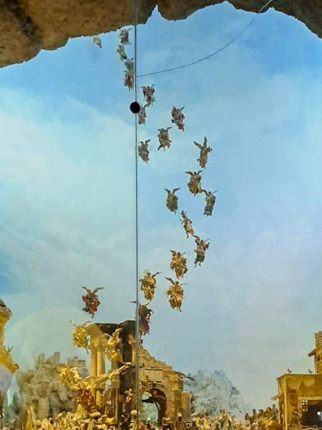 Nativity scene with angels above a village, part of Castel Sant'Elmo and Certosa di San Martino tour in Naples.