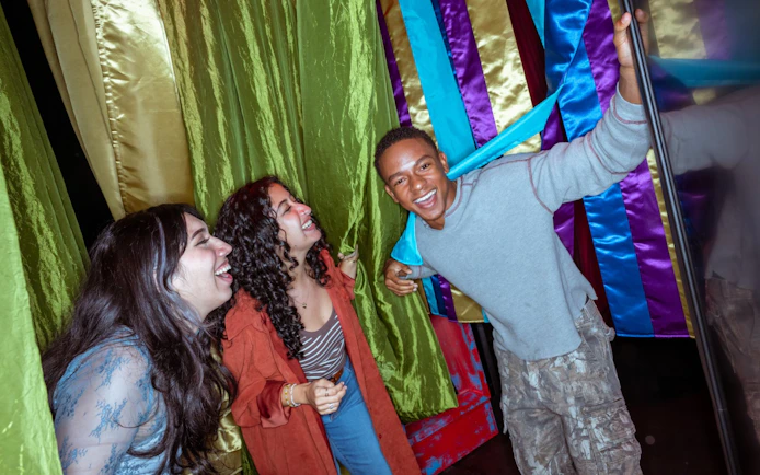 Visitors enjoying the colorful Wednesday play set at Netflix House, Philadelphia.