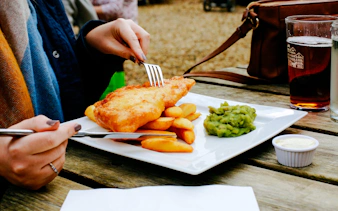 Fish and chips with mushy peas at a pub near Victoria.