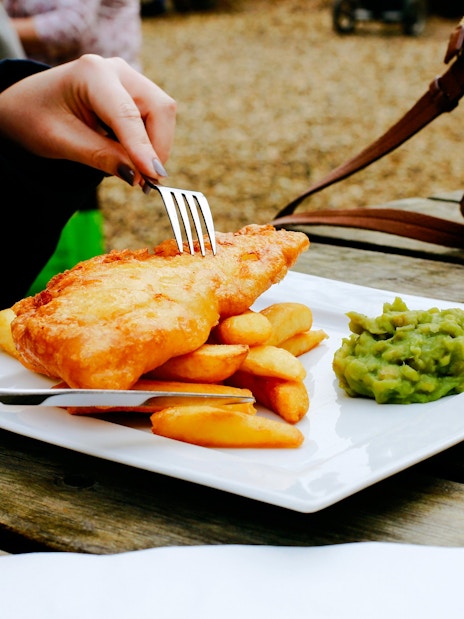 Fish and chips with mushy peas at a pub near Victoria.