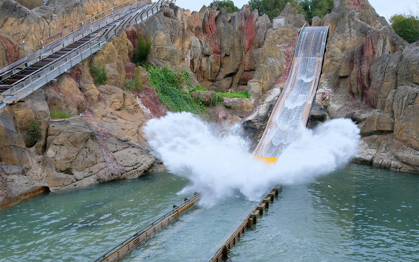 Polynesia-themed jungle area at PortAventura with lush greenery and tropical structures.