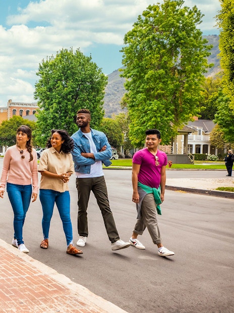 Guide leading a group tour at Warner Bros. Studio, Burbank, with diverse visitors.