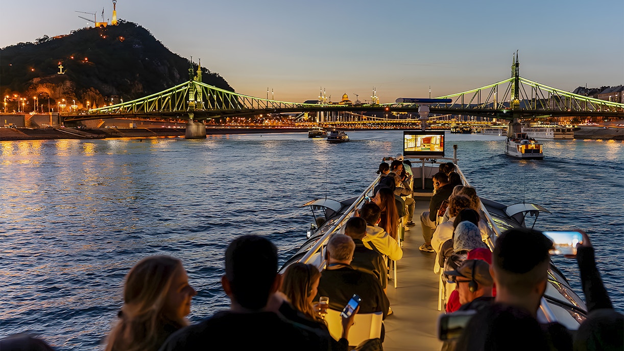 Tourist on Budapest cruise near the Liberty Bridge