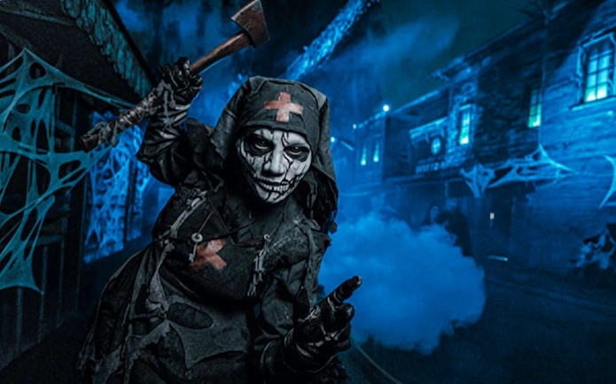 Haunted character with axe at Knott's Berry Scary Farm, Southern California.