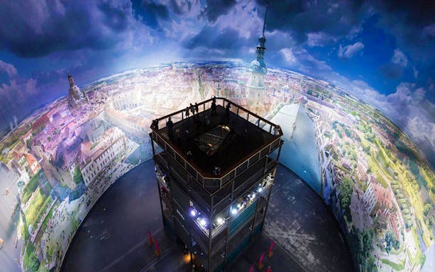 Panoramic view inside Panometer Dresden with cityscape mural.