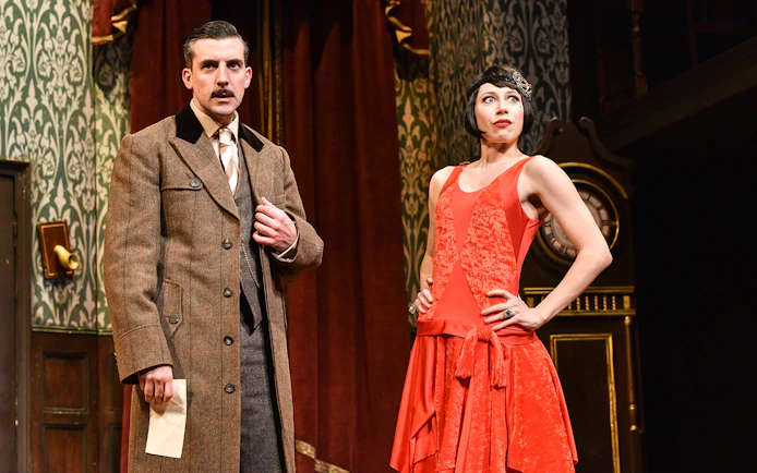 Actors in period costumes on stage during "The Play That Goes Wrong.