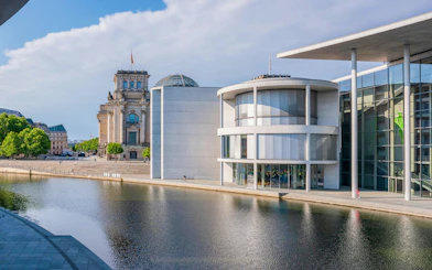 Reichstag and Spree River view from pedestrian bridge in Berlin.
