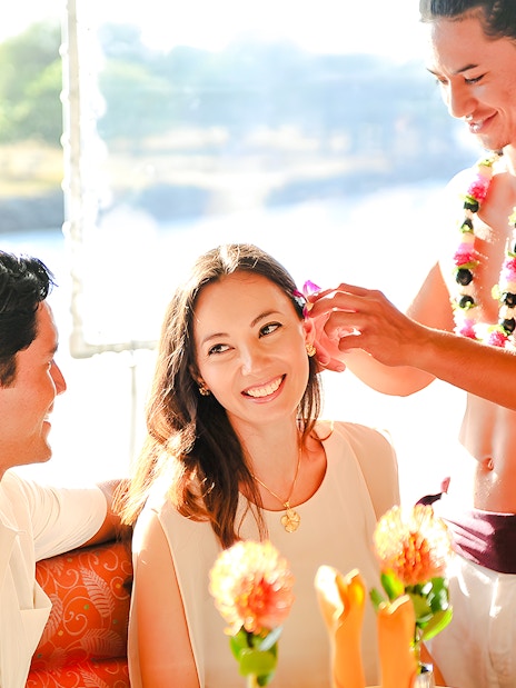 Guests enjoying a flower ceremony on the Star of Honolulu, Three Star cruise.