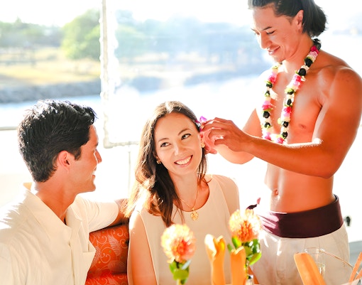 Guests enjoying a flower ceremony on the Star of Honolulu, Three Star cruise.