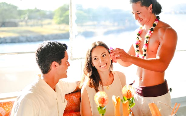 Guests enjoying a flower ceremony on the Star of Honolulu, Three Star cruise.