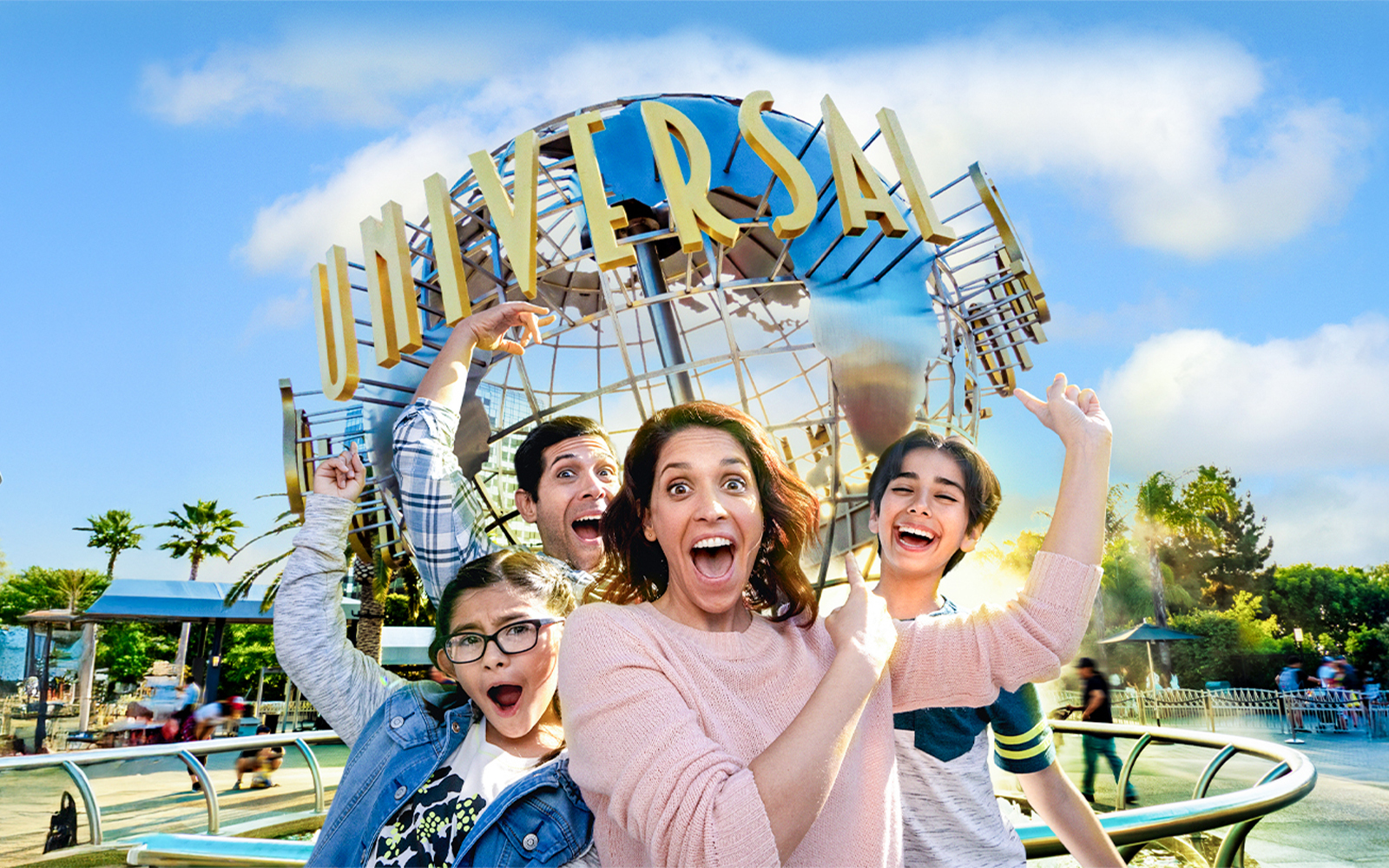 Family taking a selfie in front of the Universal globe at Universal Studios, Los Angeles.