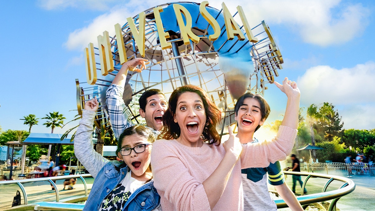 Family taking a selfie in front of the Universal globe at Universal Studios, Los Angeles.