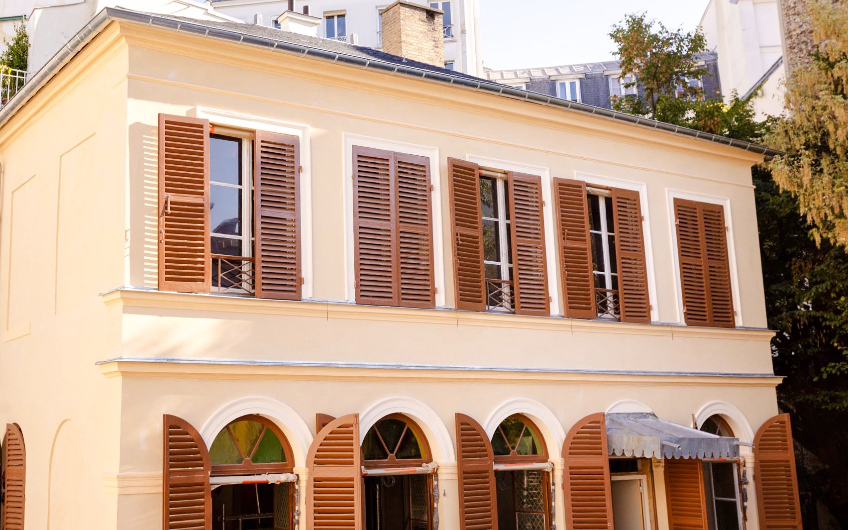 Musée de la Vie romantique facade with brown shutters, Paris, France.