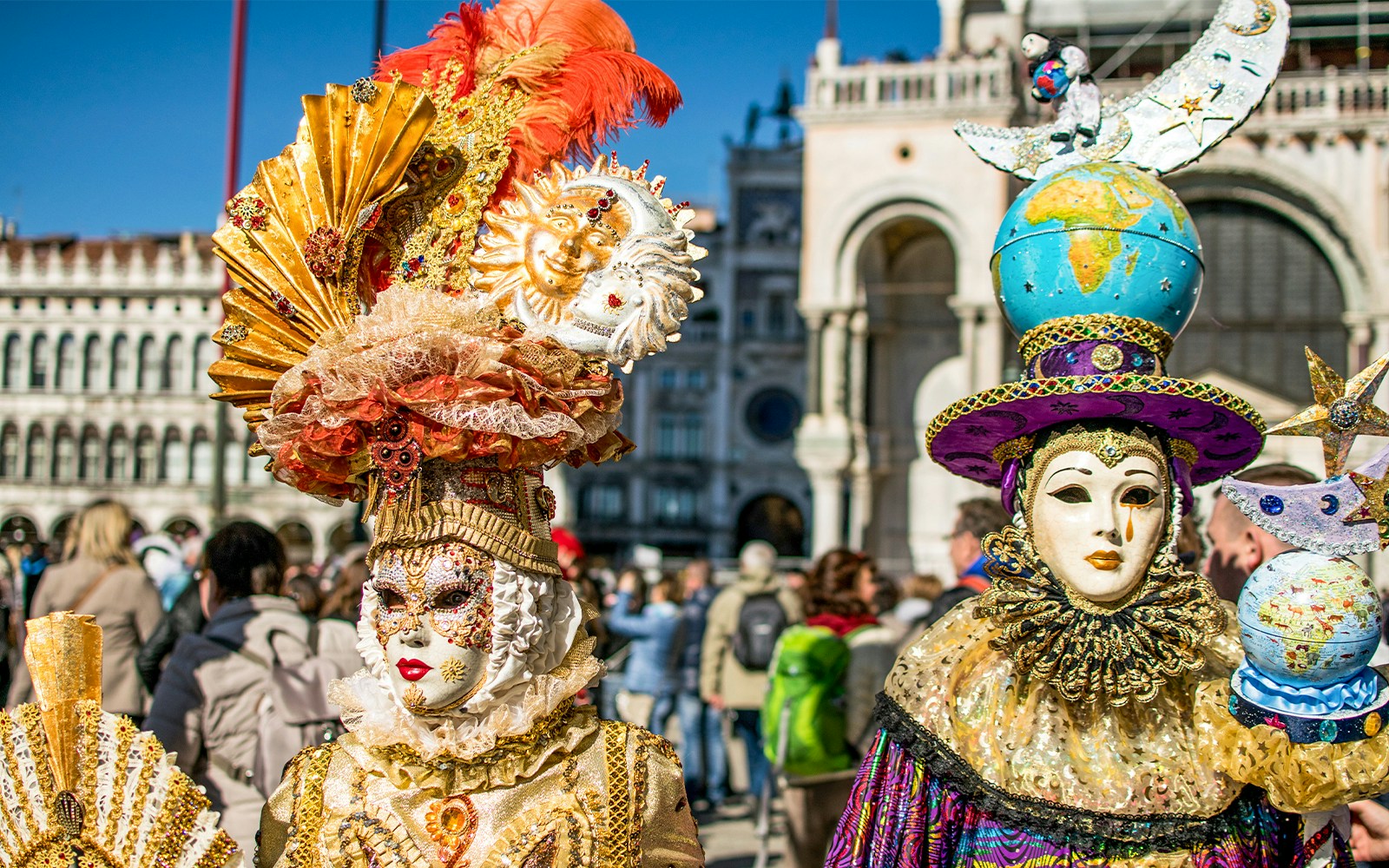 Venice Carnival participants in traditional masks and costumes, Italy.