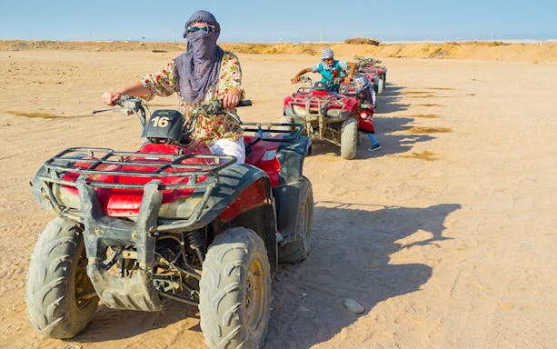 ATV riders in desert during Hurghada Super Safari tour.