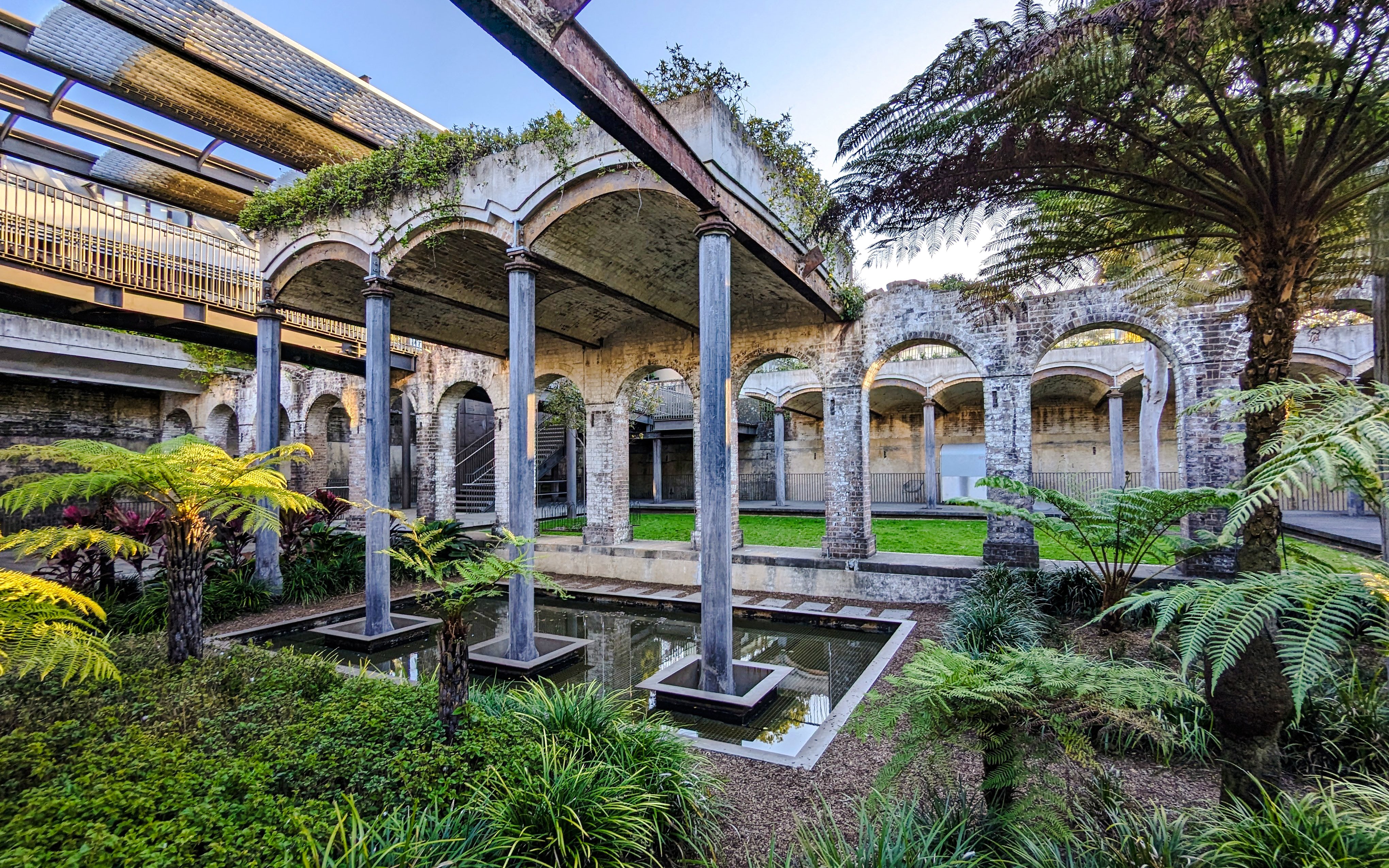 Paddington Reservoir Gardens in Australia with arches, greenery, and water features.