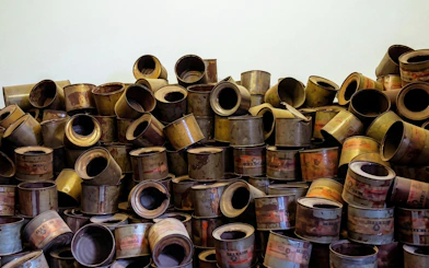 Empty Zyklon B cans at Auschwitz Museum exhibit, Krakow to Auschwitz tour.