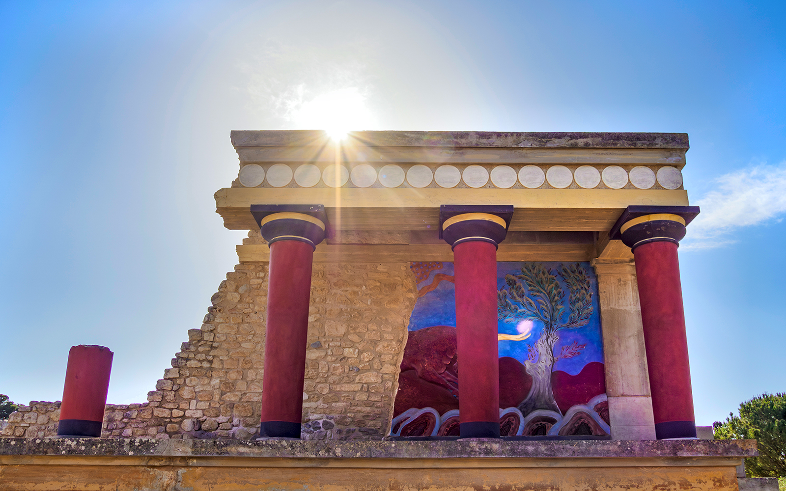 Palace of Minos ruins at Knossos, Crete, showcasing ancient Minoan architecture and archaeological site.