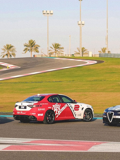 Alfa Romeo Giulia Quadrifoglio cars on Yas Marina Circuit track.