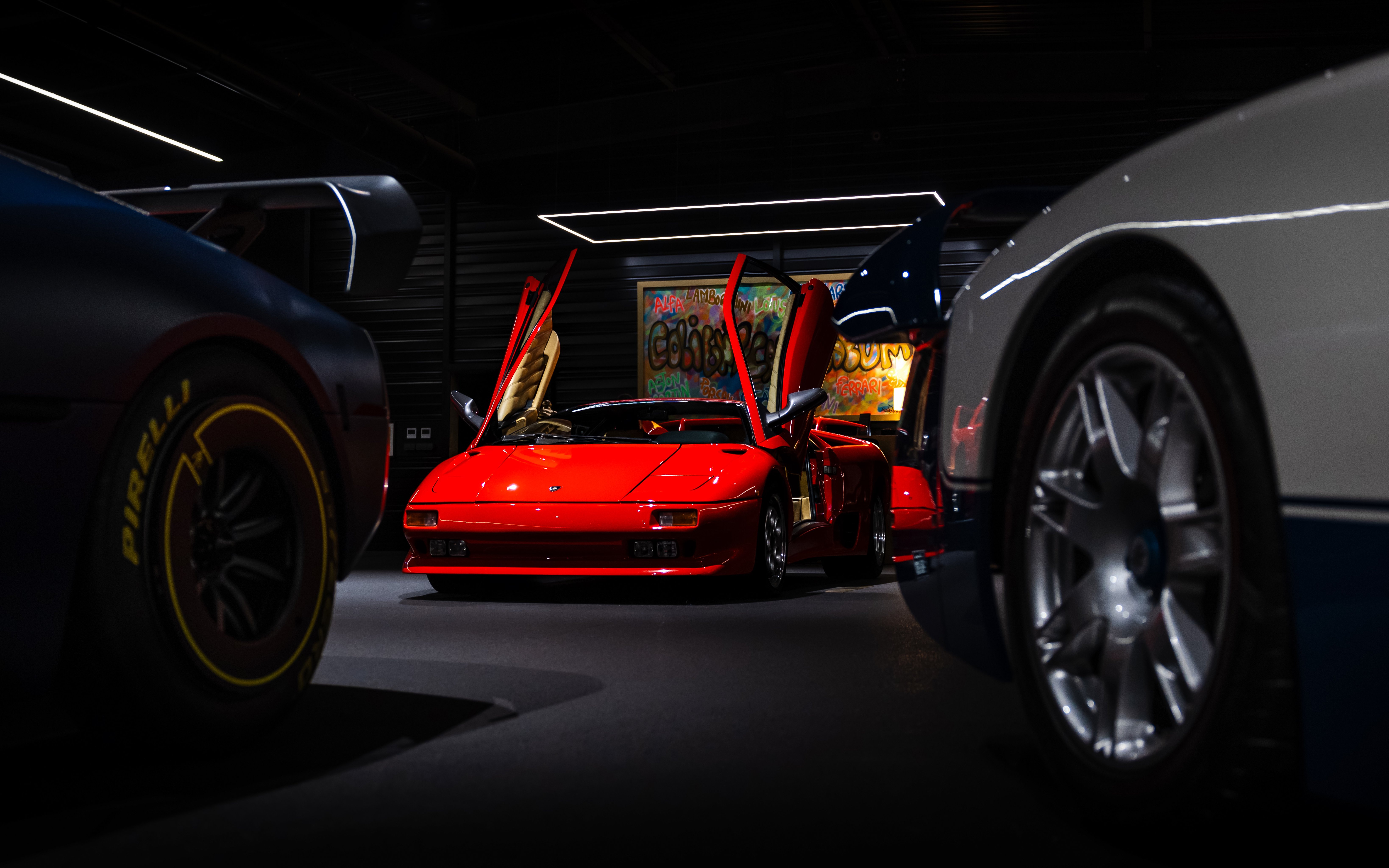 Red sports car with open doors at Coligny Car Museum, Lyon, France.