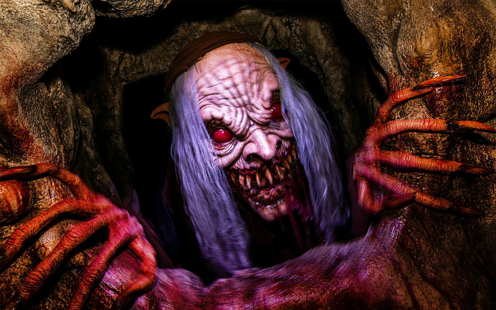 Creepy creature with long claws at Hollywood Horror Nights, Universal Studios Hollywood, Los Angeles.