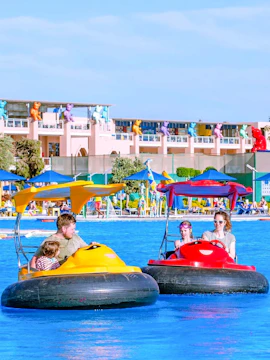 Family enjoying bump boat ride at Neverland Waterpark, Pickalbatros, Hurghada.