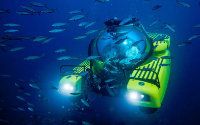 Tourists inside submersible at "Into the Ocean: Journey Beneath" exhibition, Singapore ArtScience Museum.
