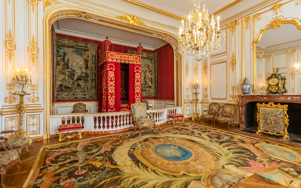 Private chamber with ornate decor in Chambord Castle, Loire Valley.