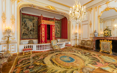 Private chamber with ornate decor in Chambord Castle, Loire Valley.