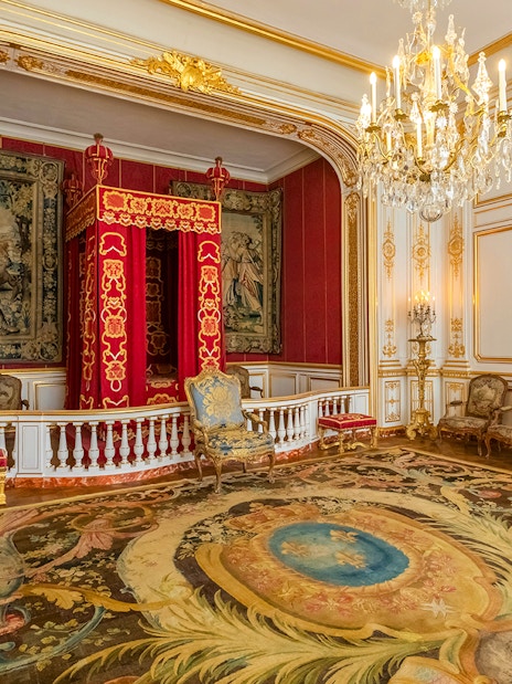 Private chamber with ornate decor in Chambord Castle, Loire Valley.