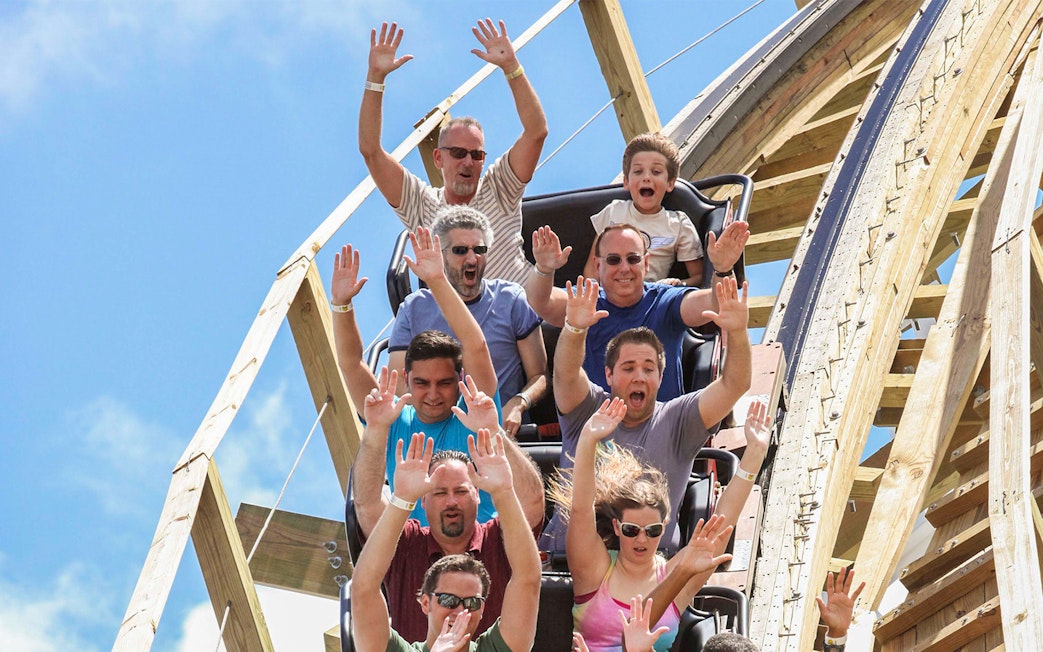 Visitors enjoying a roller coaster ride at Fun Spot America Theme Park.