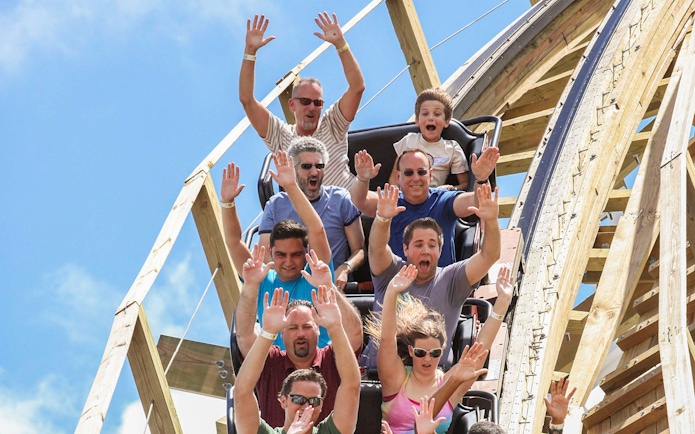 Visitors enjoying a roller coaster ride at Fun Spot America Theme Park.
