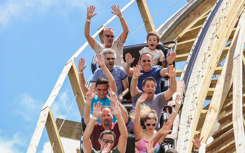 Visitors enjoying a roller coaster ride at Fun Spot America Theme Park.