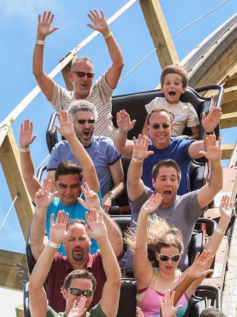Visitors enjoying a roller coaster ride at Fun Spot America Theme Park.